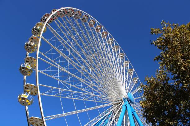 istock Ferris wheel against blue sky 1140989858