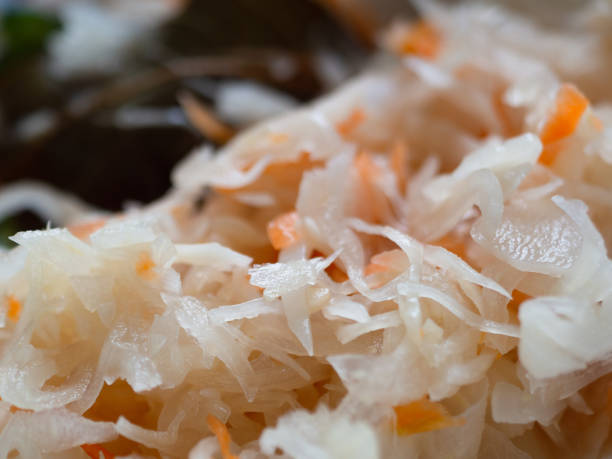istock fermented cabbage with carrots. close-up. Appetizing looks. In the blur laurel 1140990647