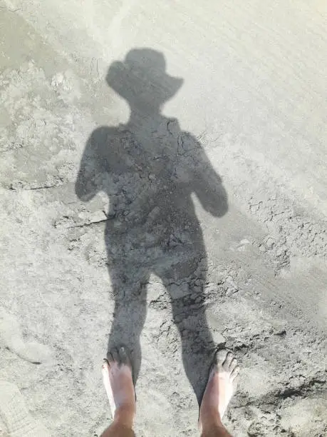 Photo of Silhouette of a Man into the sand