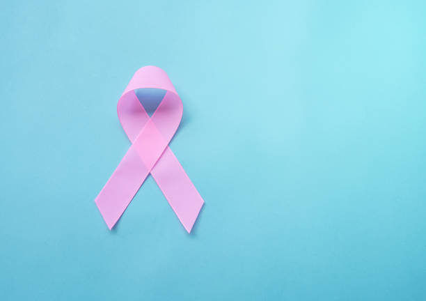 istock Pink ribbon on blue background. 1140990996