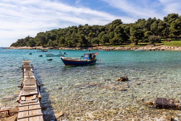 istock Boats surrounded by transparent water Pula Croatia 1140993270