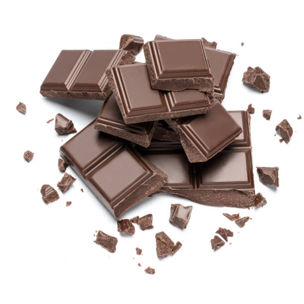 istock Dark organic chocolate pieces isolated on white background 1140996345