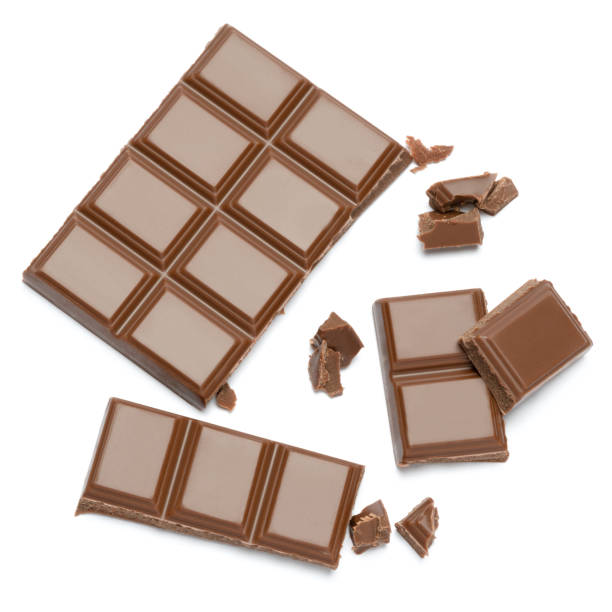 istock Milk organic chocolate pieces isolated on white background 1140996438