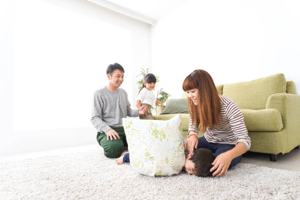 istock Family playing at home 1140998318