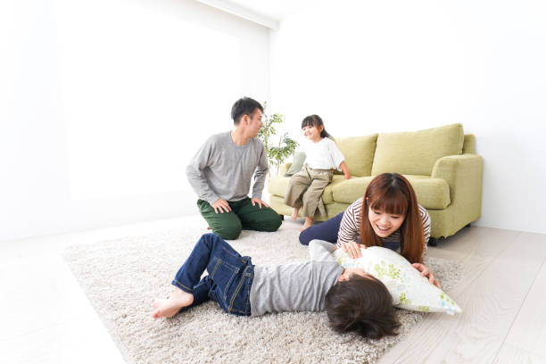istock Family playing at home 1140998321