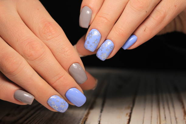 istock Beautiful woman's nails with beautiful christmas manicure 1141002841