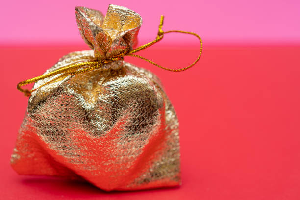 heart in a gold bag is a gift for Valentine's Day