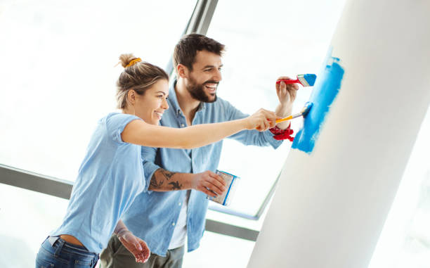 istock Young couple moving in together. 1141004038
