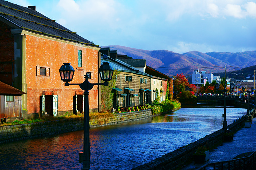 Otaru, Japan- 29 October 2018: Otaru Canal was once a central part of the city's busy port in the first half of the 20th century. Now, fanked by restaurants, shops & vendors, this historic canal has a romantic, old-timey ambiance.