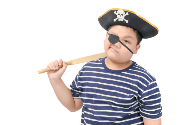 istock Kid pirate holding wood sword isolated 1141004724