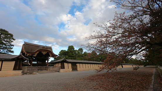 Tokyo, Japan -November  1, 2018: Ninomaru Palace's main gate in the castle Niko in Kyoto, Japan. Nijo castle, built in 1626, consists of two concentric rings of fortifications, the Ninomaru Palac with various support buildings and several gardens.