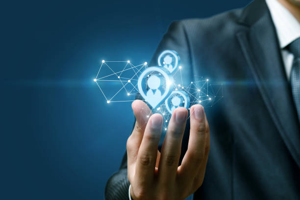 istock A hand of a businessman holding a structure of potential clients structure. 1141007332