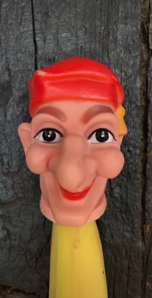 istock Finger punch puppet, clown or fool, black background 1141007825