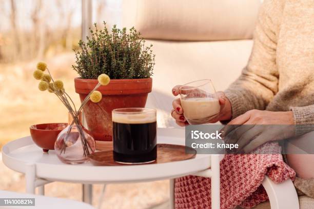 Close Up Of Woman Drinking Irish Coffee Liqueur Stock Photo - Download Image Now - 30-39 Years, Adult, Adults Only