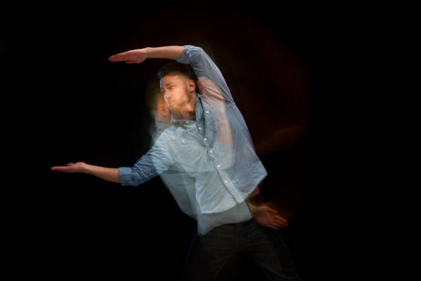 istock Handsome man in a blue shirt dancing 1141008300