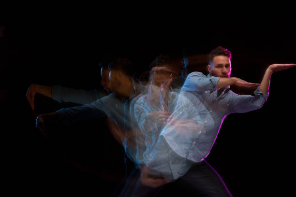istock Handsome man in a blue shirt dancing 1141008304