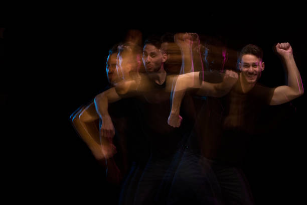 istock Good looking man in a black shirt dancing 1141009619