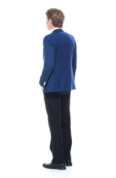 istock Handsome man holding a question mark sign and wearing a blue blazer 1141009624
