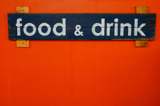 Wooden Food and drink sign on red wall