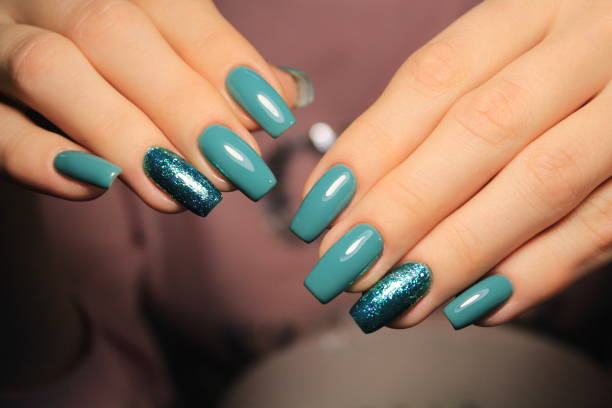 istock Beautiful woman's nails with beautiful christmas manicure 1141009853