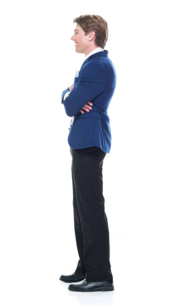 istock Handsome man holding a question mark sign and wearing a blue blazer 1141009997