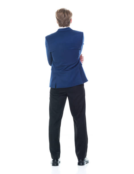 istock Handsome man holding a question mark sign and wearing a blue blazer 1141011084