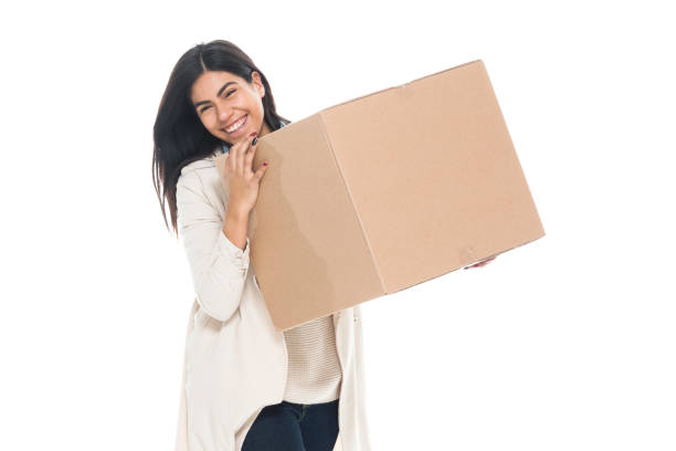Attractive young latino female is holding a box