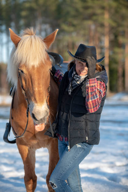 istock Woman horseback riding 1141014265