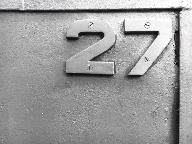 istock Silver number 27 on a old silvery metallic background 1141015295