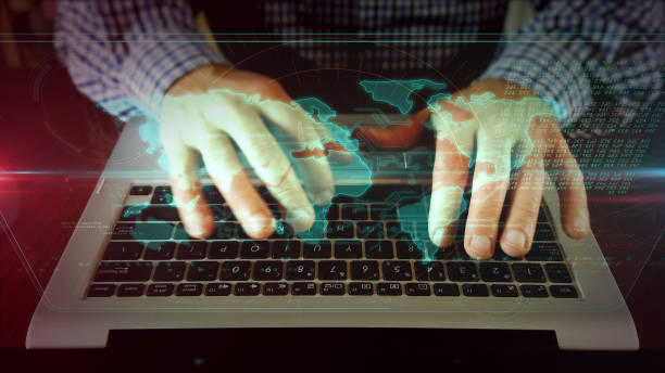 istock Man writing on laptop keyboard with world map 1141015591