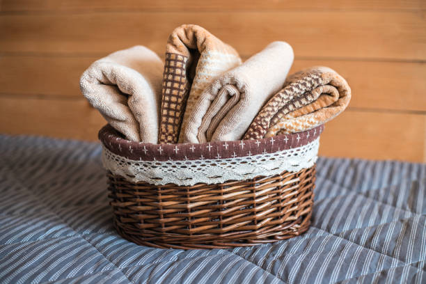 istock Basket with bath towels on textile background. 1141016053