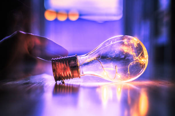 istock Time for ideas, inspiration and invention: Hands are holding a LED lightbulb. 1141017251