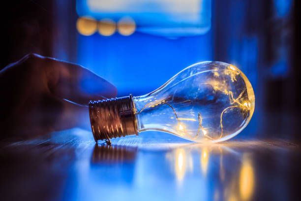 istock Time for ideas, inspiration and invention: Hands are holding a LED lightbulb. 1141017290
