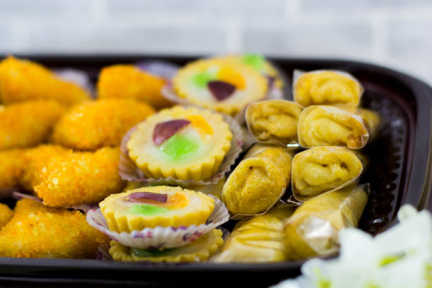 istock variety of traditional indonesia cake's inside plastic packaging on wood and white brick -image 1141018453