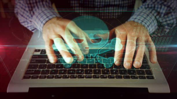 istock Man writing on laptop keyboard with skull 1141022849