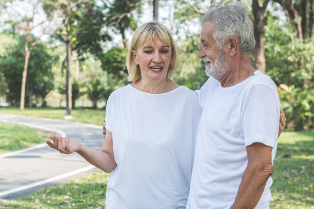 istock Happy senior couple smiling outdoors in nature 1141022883