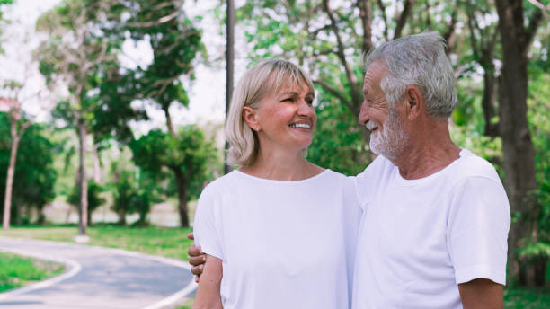 istock Happy senior couple smiling outdoors in nature 1141023120
