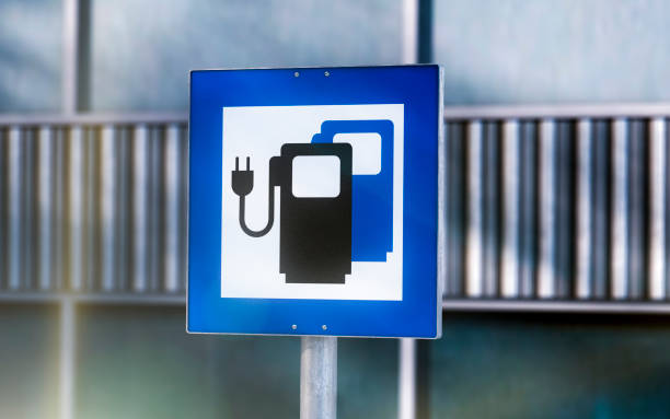 istock Electric car charging sign parking lot 1141024817