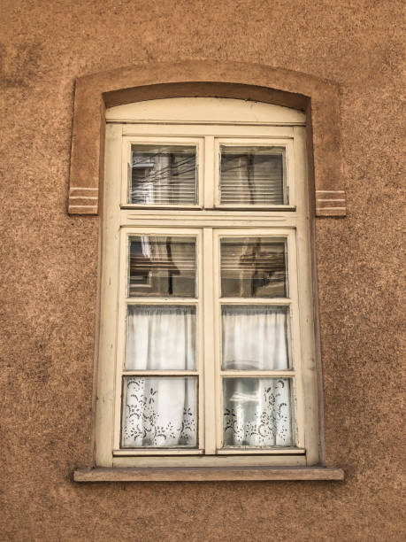 istock window of a house with vintage curtains 1141026000
