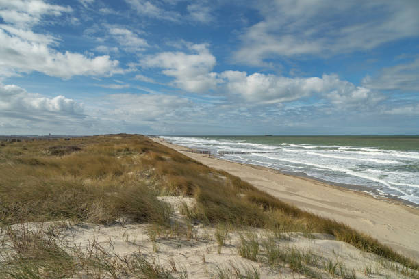 istock View from Dunes with awesome Sky at springtime to Domburg Beach/ Netherlands 1141026125
