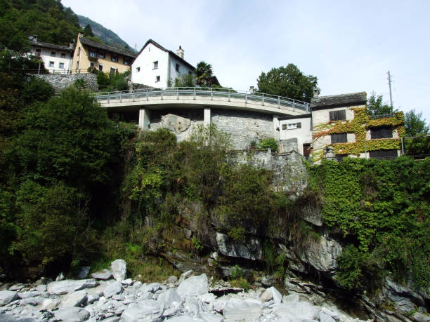 a typical old traditional architecture in the magic valley or valle di magia (valle maggia) - switzerland ticino canton valley church imagens e fotografias de stock