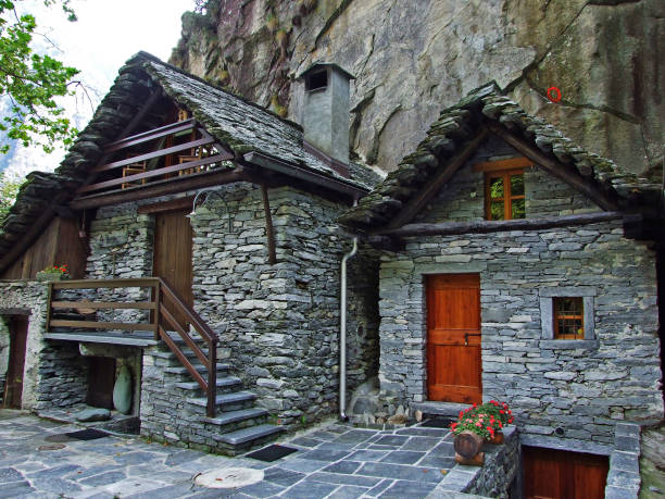 a typical old traditional architecture in the magic valley or valle di magia (valle maggia) - switzerland ticino canton valley church imagens e fotografias de stock