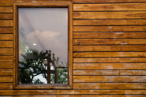 Plastic PVC Window in New Modern Passive Wooden House Facade Wall. PVC Windows are the Number One in House Energy Efficiency