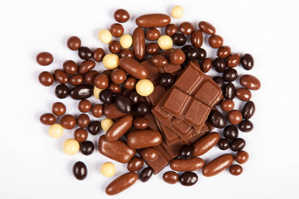 istock Milk chocolate pieces isolated on white background from top view 1141031393