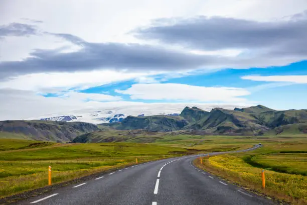 Route 1 or Ring Road (Hringvegur) national road that runs around the island and connecs popular tourist attractions in Iceland, Scandinavia. Myrdalsjokull ice cap is seen in background