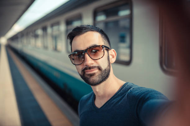 Tourist Take a Selfie in Railway Station stock photo