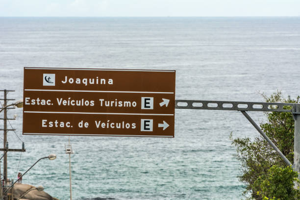 Traffic sign in front of Joaquina Beach, Florianopolis, Brazil. 2019, January. Florianopolis, Brazil. Traffic sign in front of Joaquina Beach. joaquina beach in florianopolis santa catarina brazil stock pictures, royalty-free photos & images