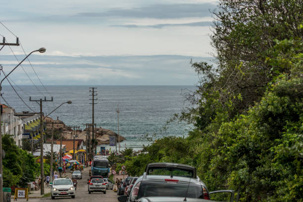 Street access to Joaquina Beach, in Florianopolis, Brazil. 2019, January. Florianopolis, Brazil. Street access to Joaquina Beach. joaquina beach in florianopolis santa catarina brazil stock pictures, royalty-free photos & images