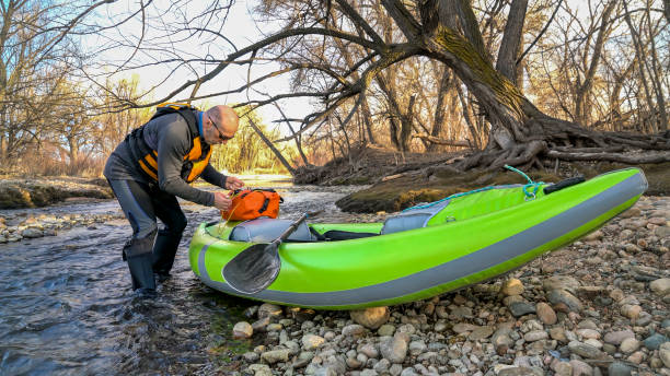 istock paddler with whitewater inflatable kayak 1141037102