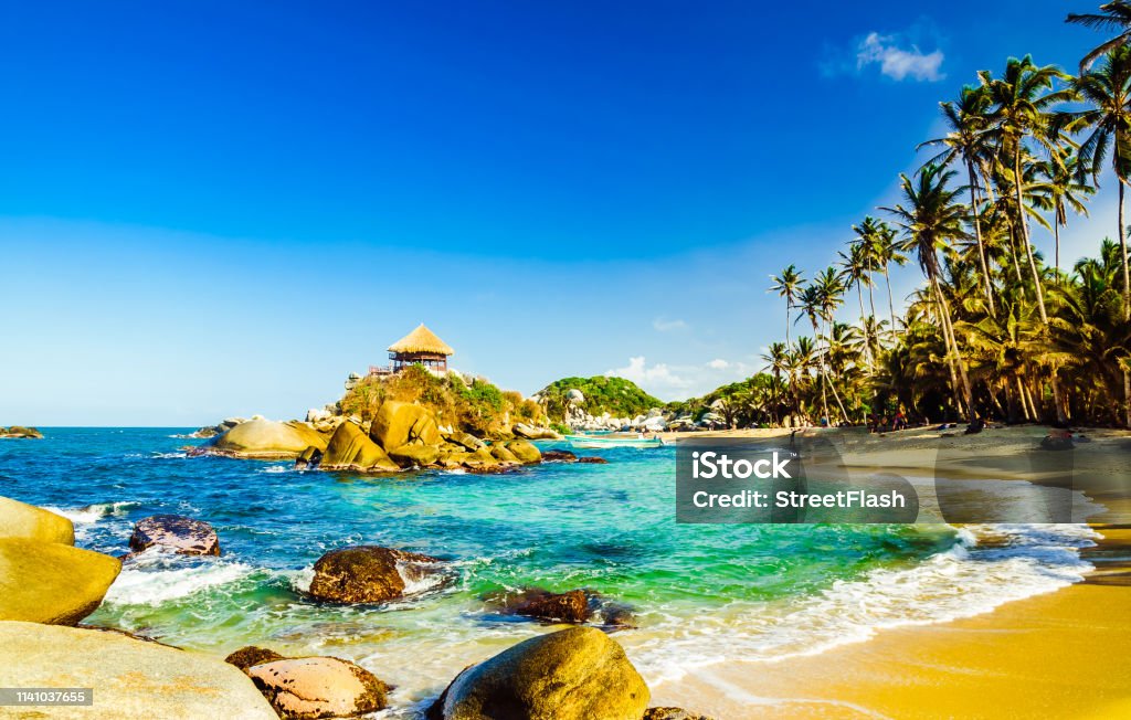 Beautiful bay with white sand beach and blue water in Tayrona national park in Colombia Viewn on beautiful bay with white sand beach and blue water in Tayrona national park in Colombia Bay of Water Stock Photo